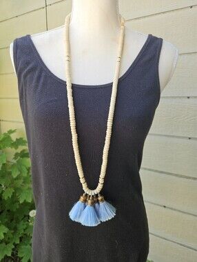 light wood necklace with blue tassels
